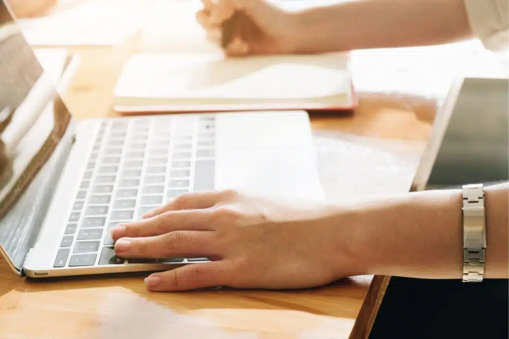 up close image of a person working on a laptop